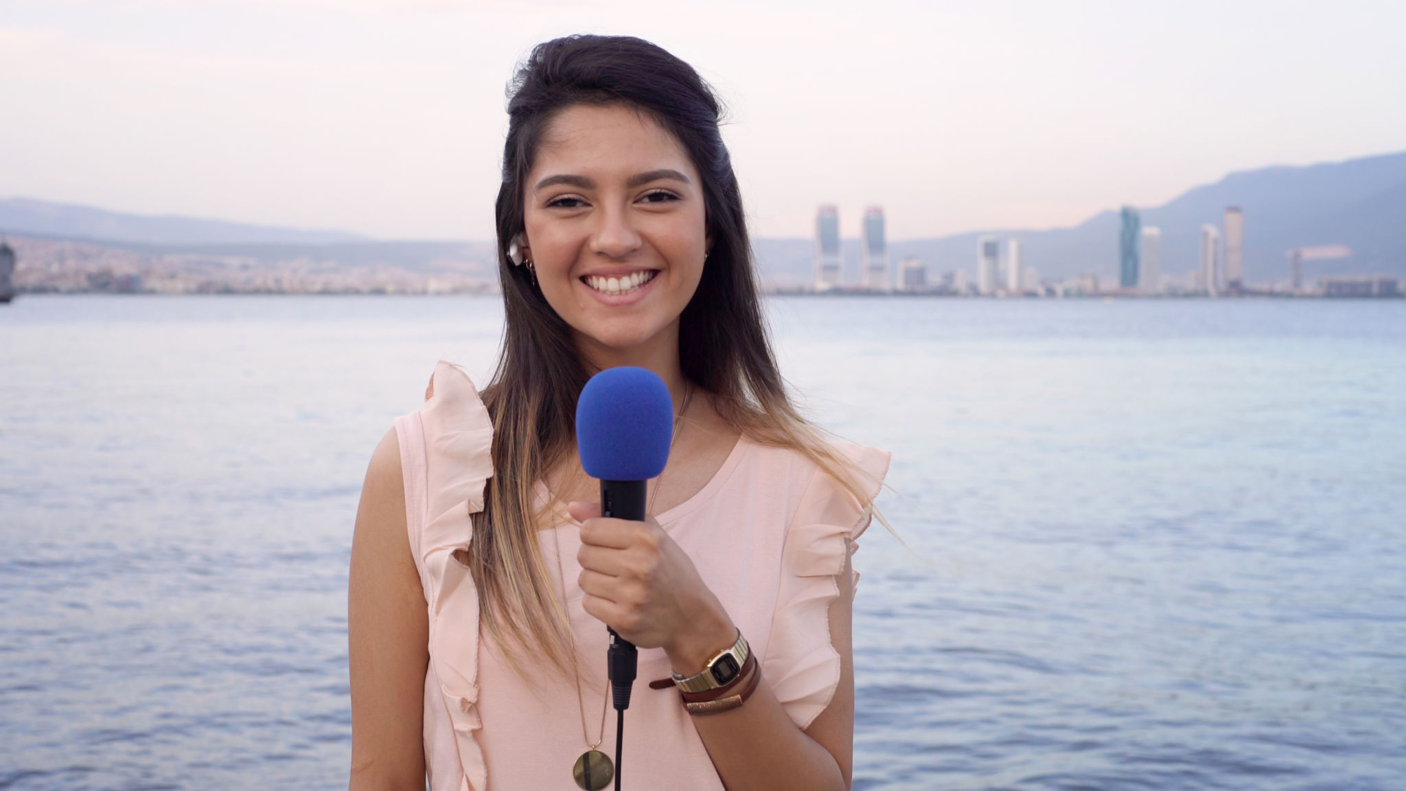 On-air host speaking into a microphone