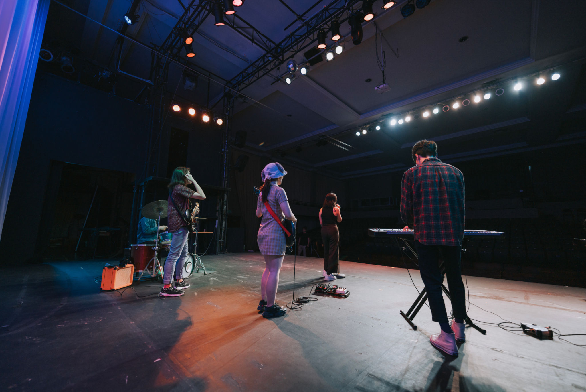 Live band performing on stage during a featured music event